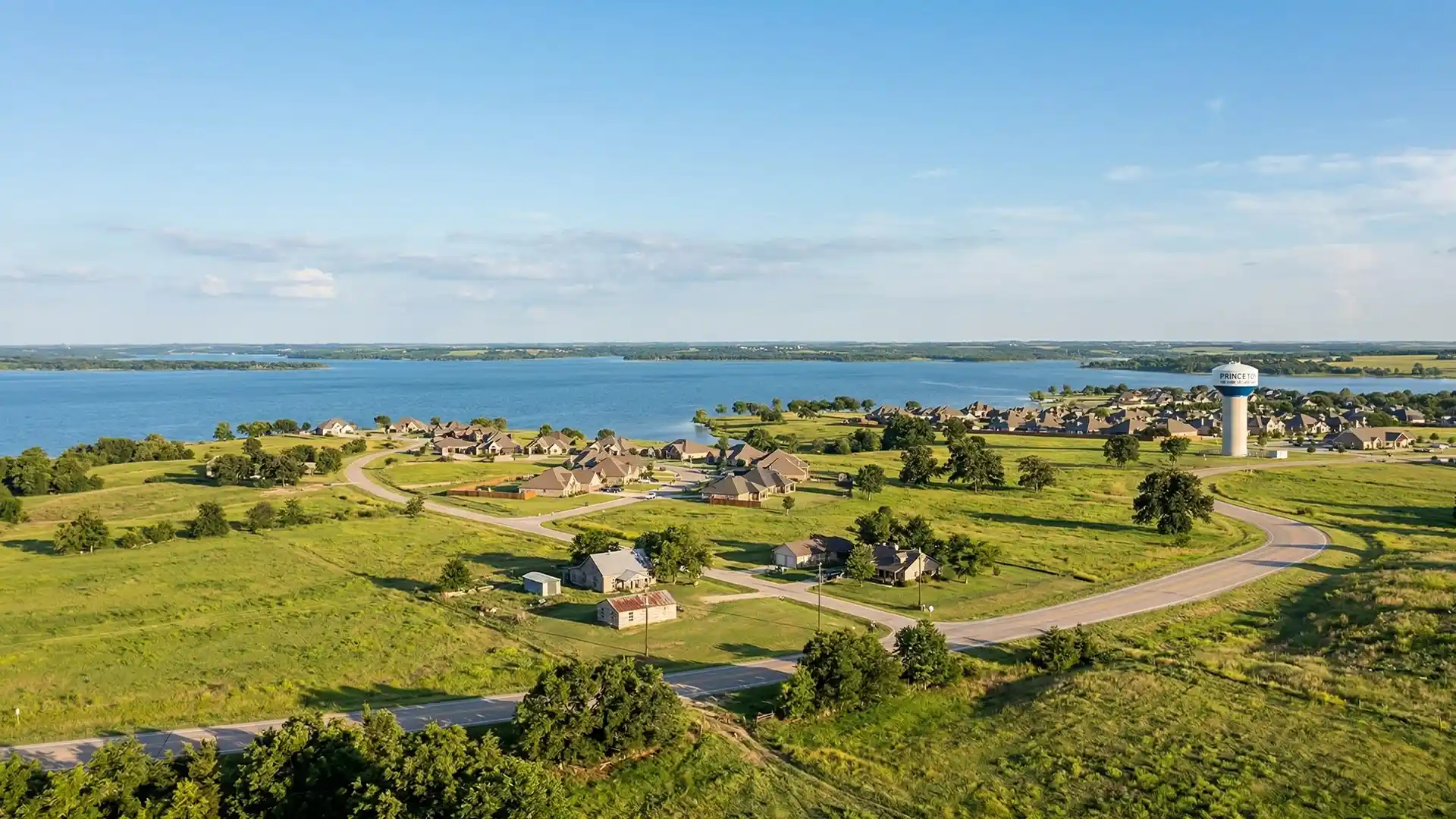 Aerial view of Princeton Texas lake community with homes near waterfront