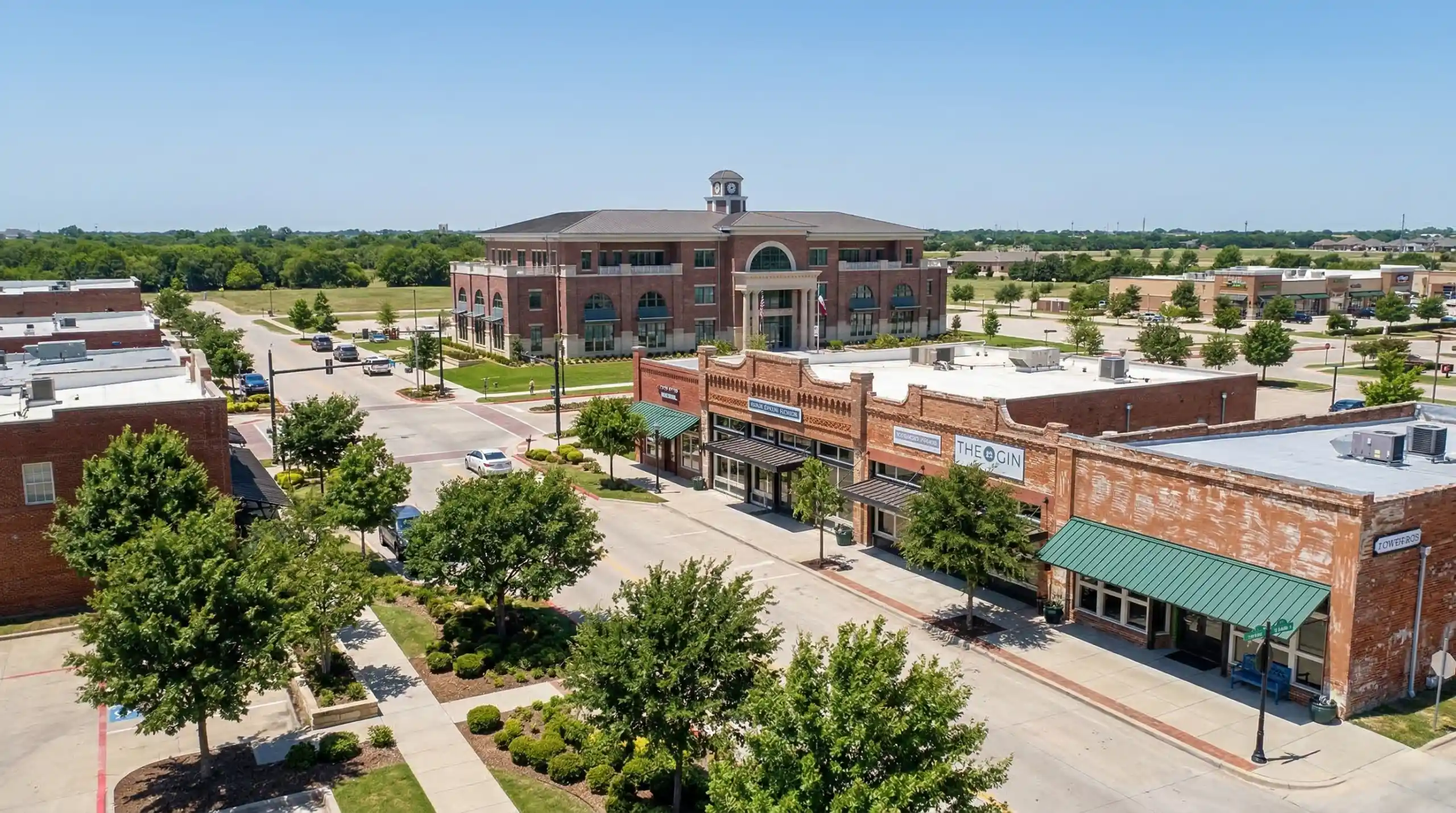 Downtown Prosper Texas with historic storefronts and city hall building